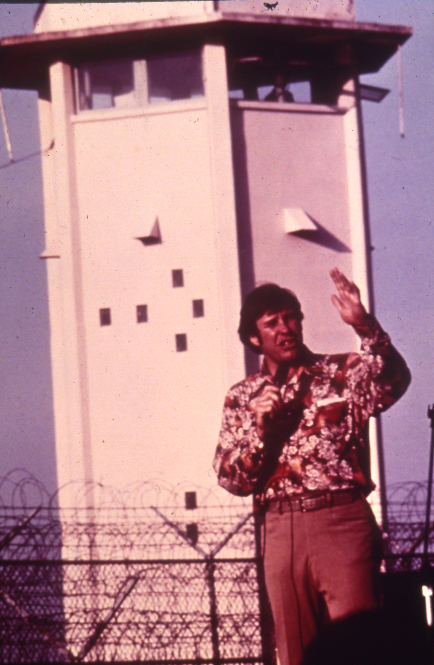 Slide 4: A photo of Bill Glass (a linebacker for the Cleveland Browns and prison evangelist) speaking at Florida State Prison in 1973 or 1974.